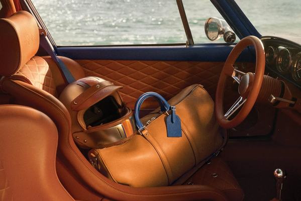 Interior of the Singer Classic with fitted Louis Vuitton bag and helmet